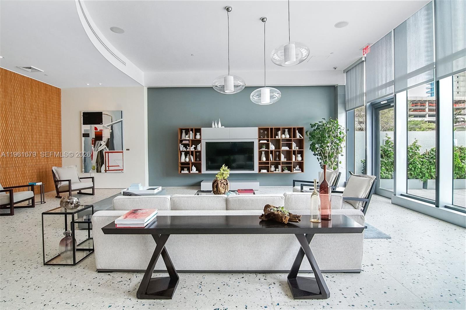 460 Northeast 28th Street, Unit 1601 Miami, FL 33137 - Photo 38 of 41 a living room with furniture a fireplace and a large window