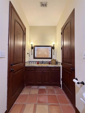 12410 Keith Road Beaumont, TX 77713 - Photo 19 of 45 a spacious bathroom with a sink and a mirror