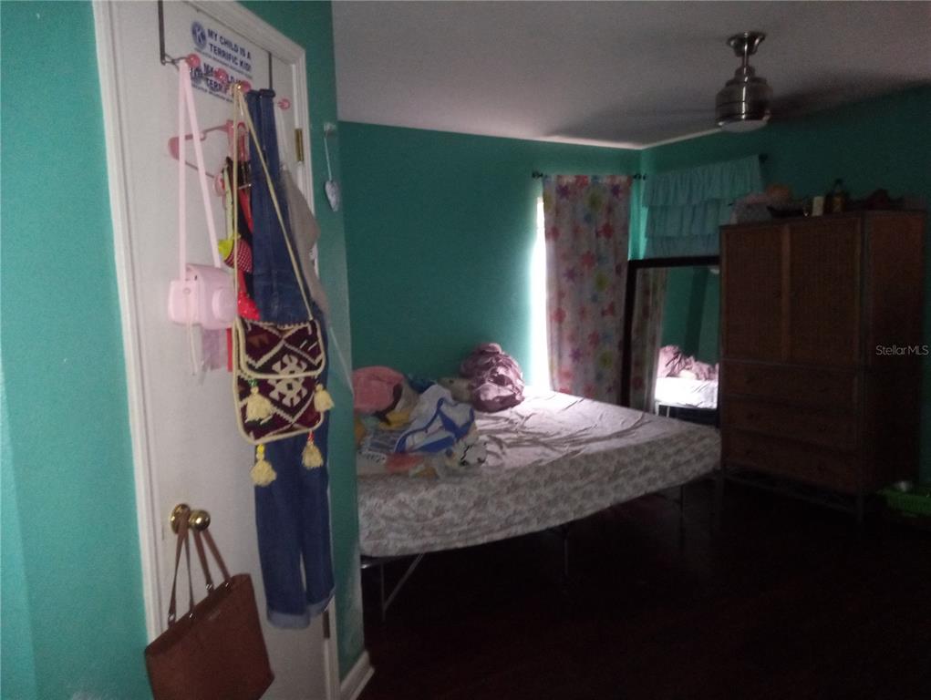 10933 Subtle Trail Drive Riverview, FL 33579 - Photo 11 of 22 a bathroom with a sink a toilet and a shower curtain