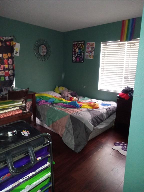 10933 Subtle Trail Drive Riverview, FL 33579 - Photo 12 of 22 a bedroom with a bed and a window