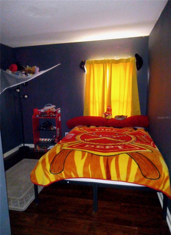 10933 Subtle Trail Drive Riverview, FL 33579 - Photo 19 of 22 a room with a bed and window