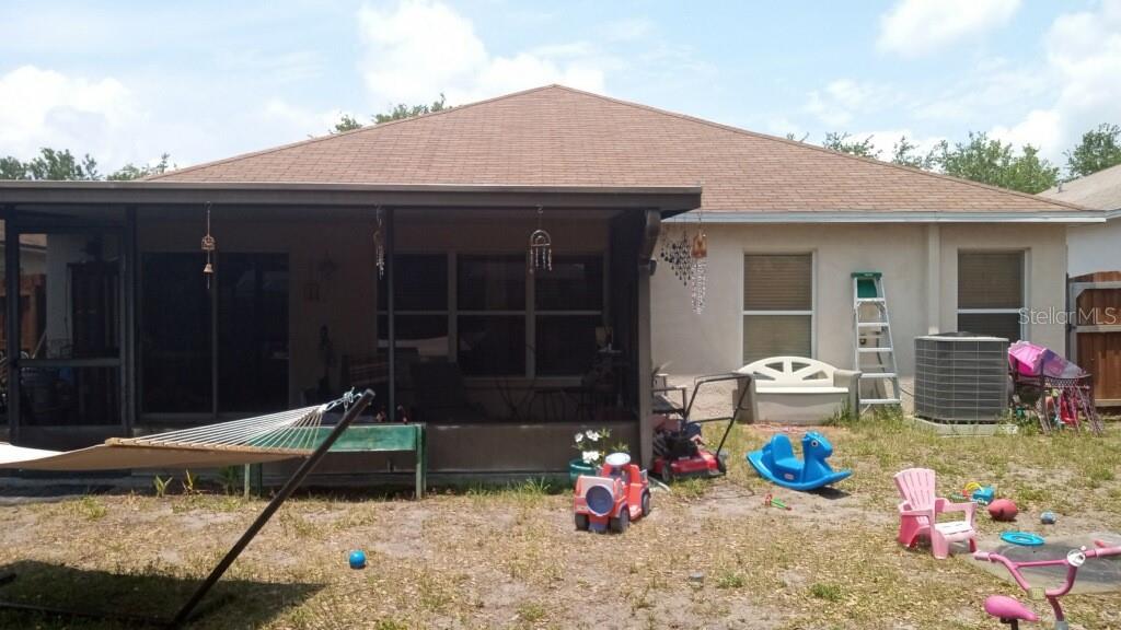 10933 Subtle Trail Drive Riverview, FL 33579 - Photo 2 of 22 a view of a lounge chair in the patio