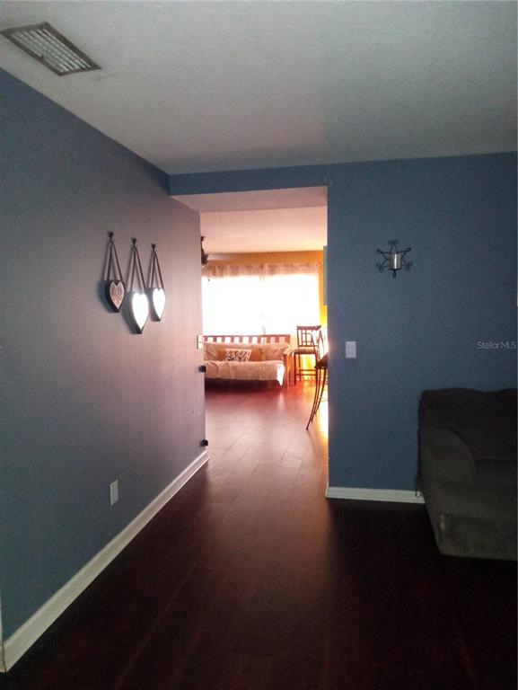 10933 Subtle Trail Drive Riverview, FL 33579 - Photo 9 of 22 a view of room with window and wooden floor