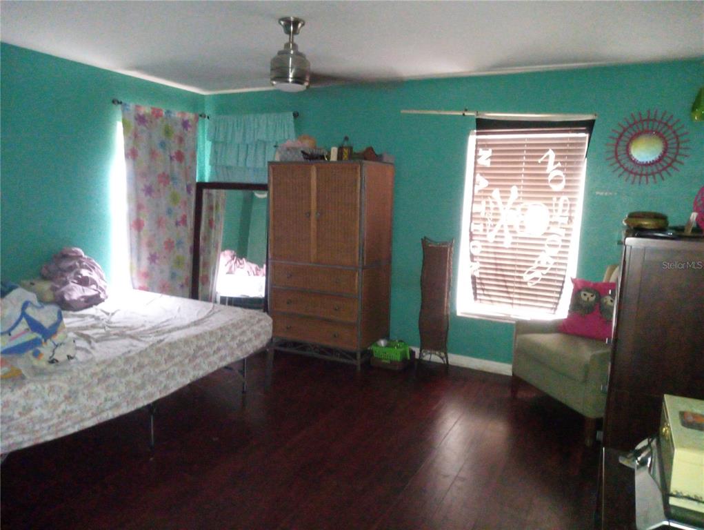 10933 Subtle Trail Drive Riverview, FL 33579 - Photo 10 of 22 a living room with hard wood floors and a wooden floor