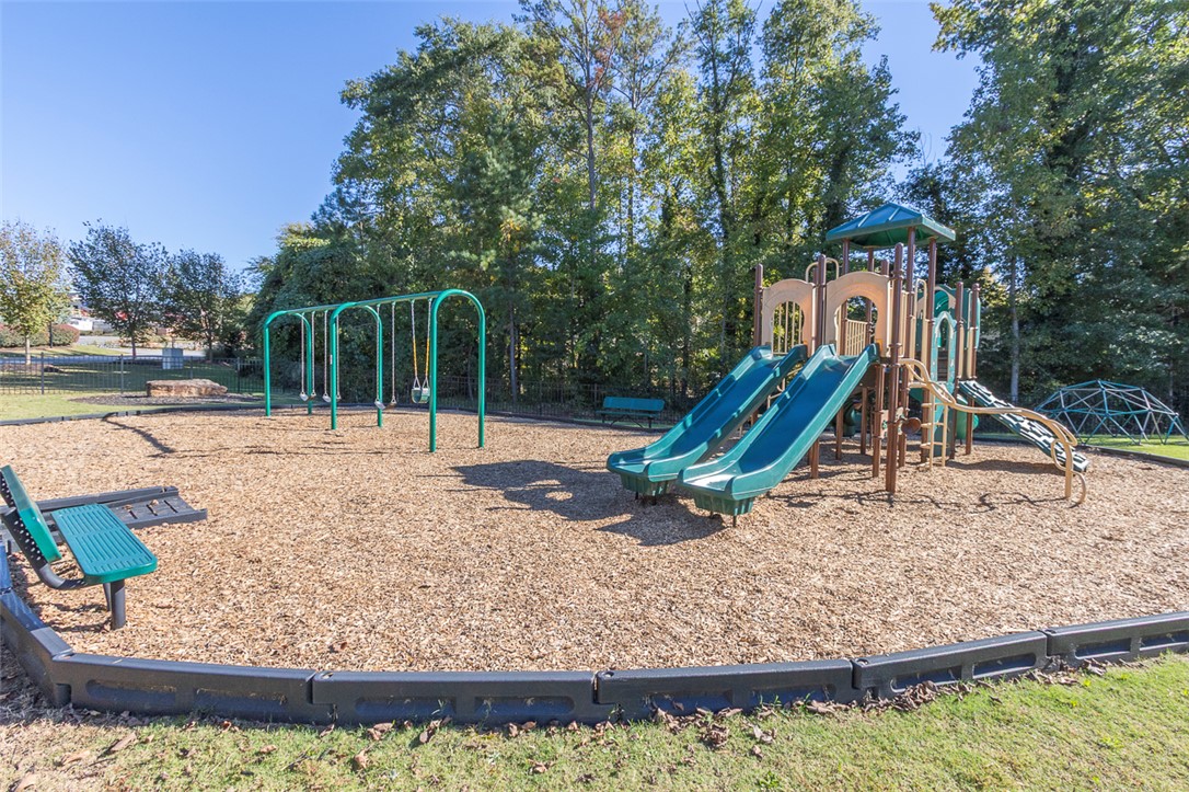 231 Millhone Way Pendleton, SC 29670 - Photo 32 of 32 This community playground offers recreation with swings and slides, set amidst natural surroundings.