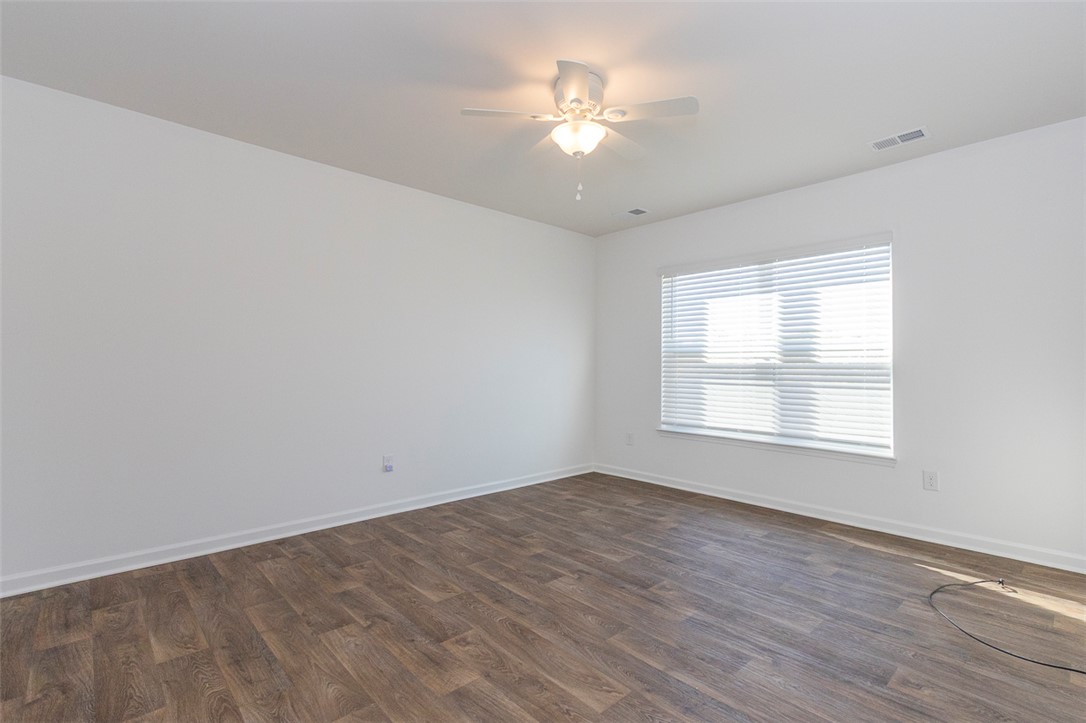 231 Millhone Way Pendleton, SC 29670 - Photo 4 of 32 This bright and airy master bedroom features durable flooring and ample natural light, perfect for any use.