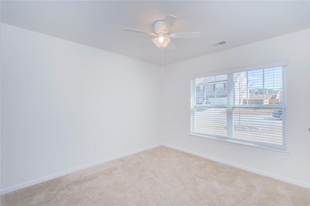231 Millhone Way Pendleton, SC 29670 - Photo 8 of 32 This bright and airy room offers carpet flooring and a refreshing ceiling fan.