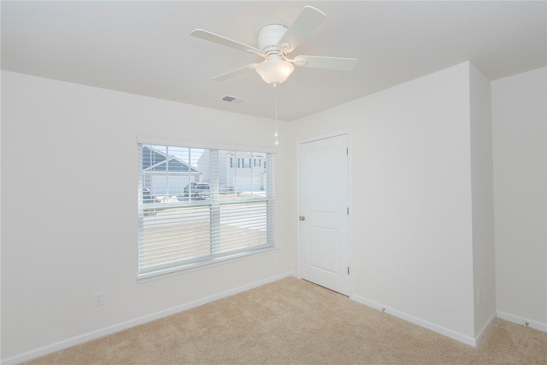 231 Millhone Way Pendleton, SC 29670 - Photo 10 of 32 This cozy bedroom features plush carpeting and a bright window with blinds.