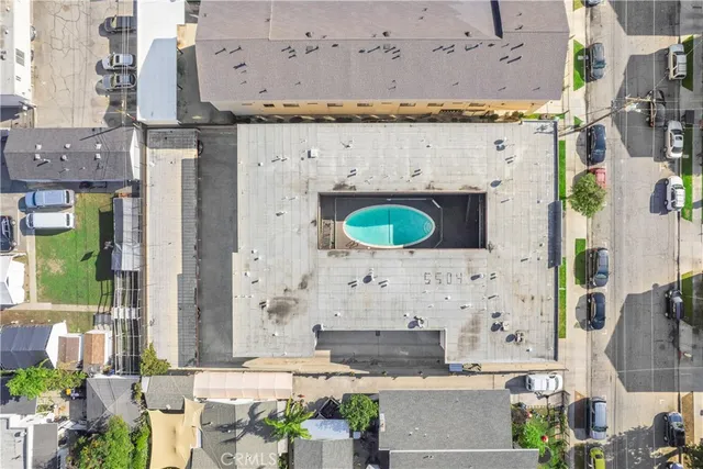 an aerial view of a house with a swimming pool