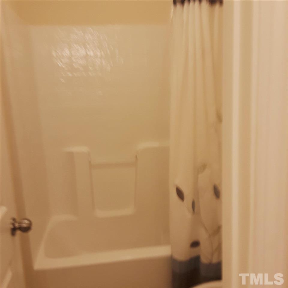 625 Briarcliff Street Apex, NC 27502 - Photo 15 of 18 a bathroom with a bathtub