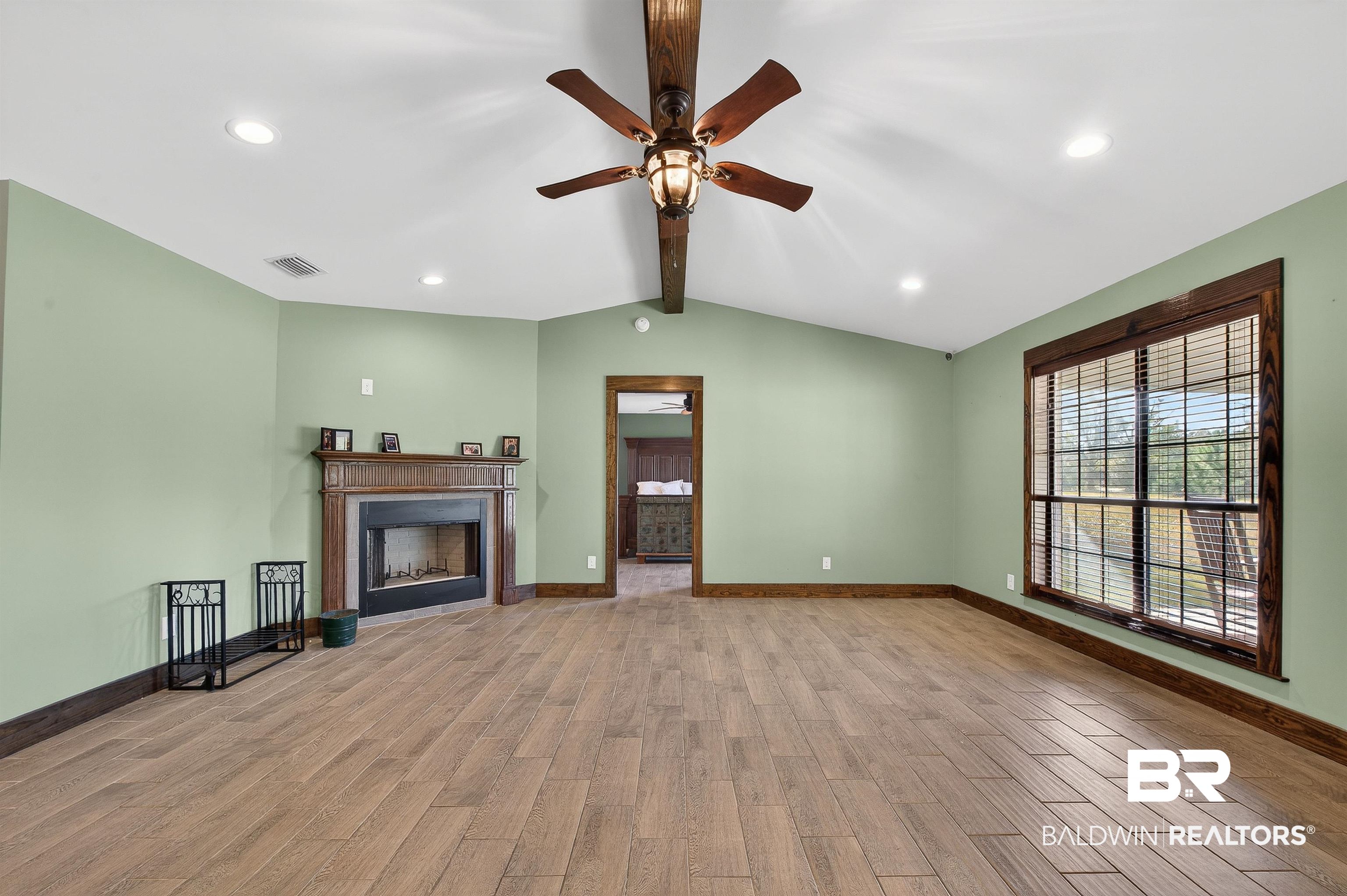 29635 Gardner Road Elberta, AL 36530 - Photo 13 of 66 Unfurnished living room featuring light wood finished floors, a fireplace, recessed lighting, and a ceiling fan