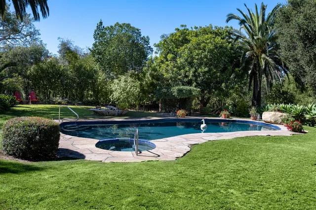 a balcony with furniture and a fireplace