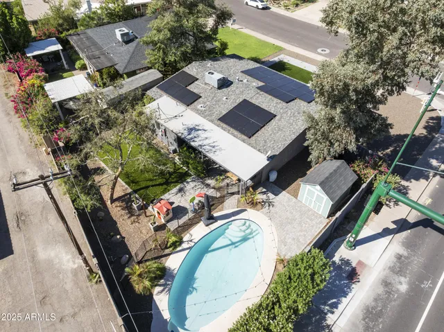 an aerial view of a house with a swimming pool