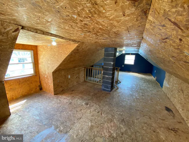 a view of an empty room with windows