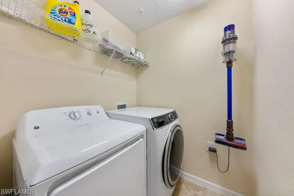 a utility room with dryer and washer