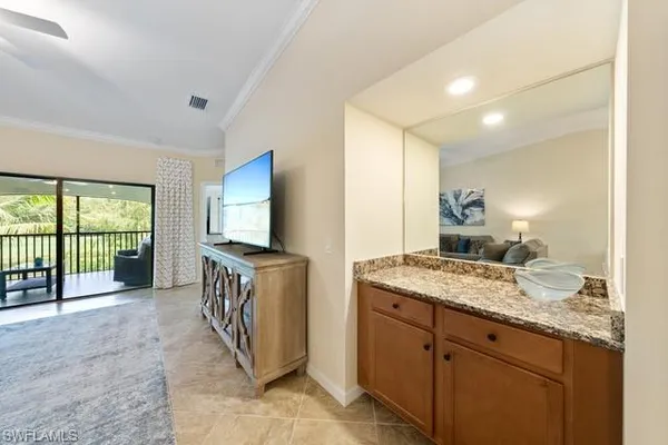 a view of living room with furniture and flat screen tv