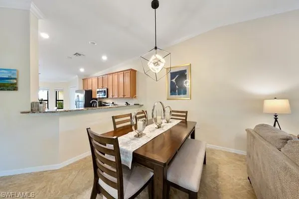a dining room with furniture and window