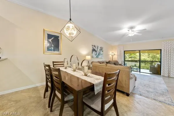 a view of a dining room with furniture window and outside view