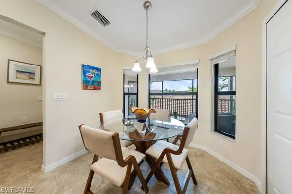 a dining room with furniture and window