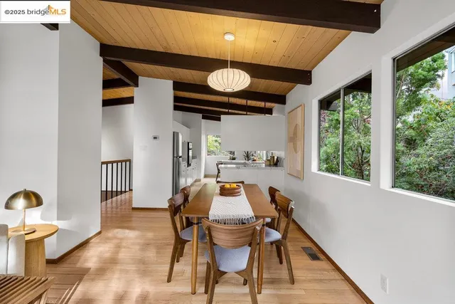 a kitchen with a table chairs and a sink