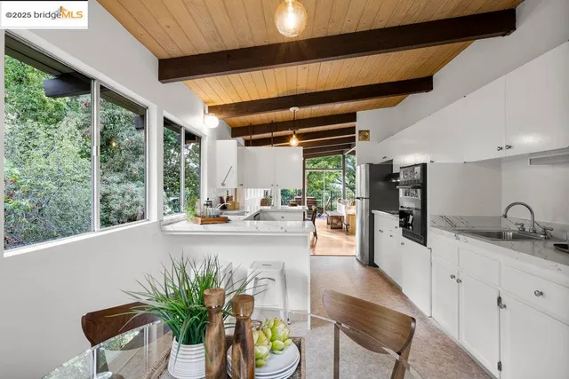 a kitchen with a sink cabinets and window