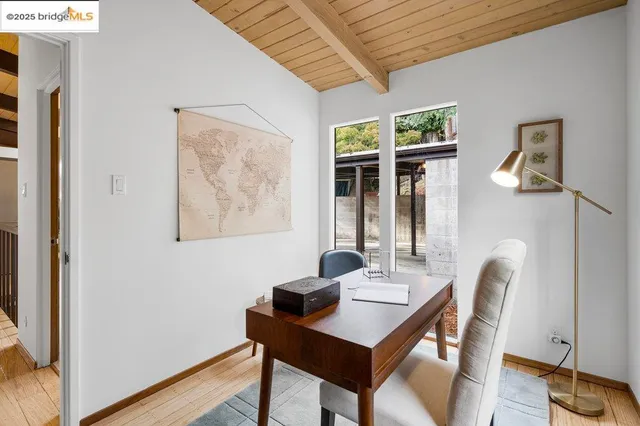a view of hallway with wooden floor