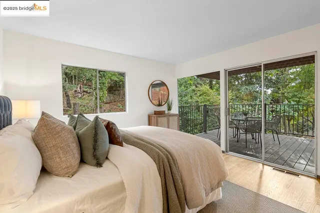 a view of a chairs and table in the balcony