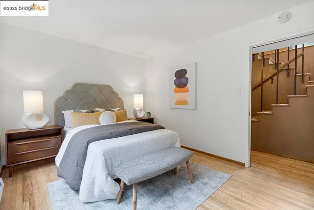 a bedroom with a large bed and a window