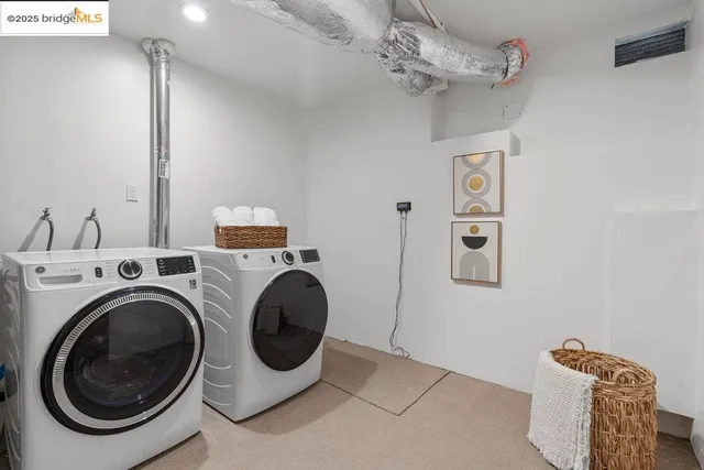 a view of a house with large windows and a small yard