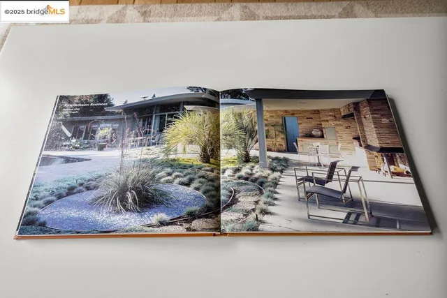 a outdoor space with patio the couches and a dining table and chairs with wooden floor