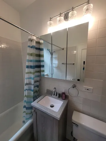 a bathroom with a toilet a sink and a bathtub