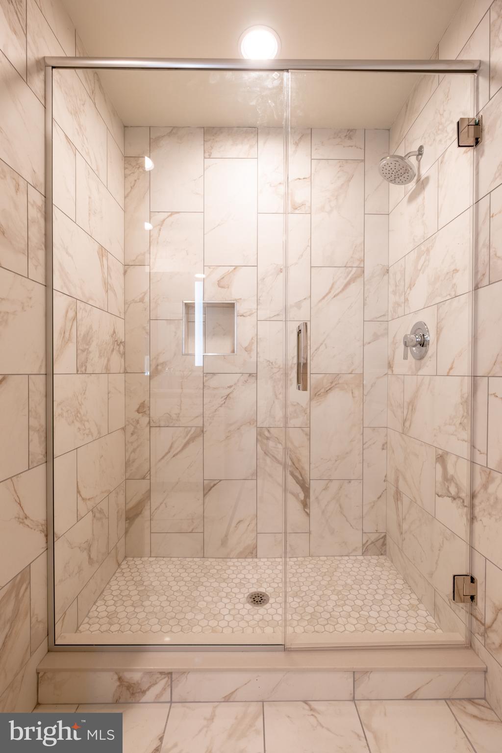 2301-61 John F Kennedy Boulevard, Unit 101 Philadelphia, PA 19103 - Photo 15 of 39 a bathroom with a shower