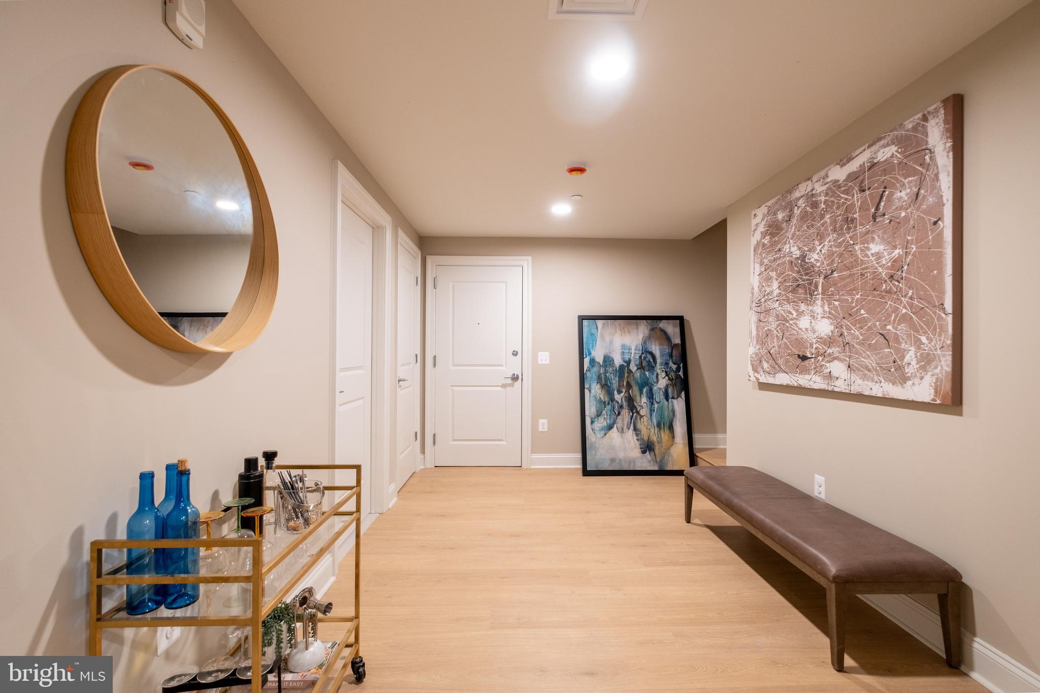 2301-61 John F Kennedy Boulevard, Unit 101 Philadelphia, PA 19103 - Photo 17 of 39 a view of a hallway with paintings on the wall