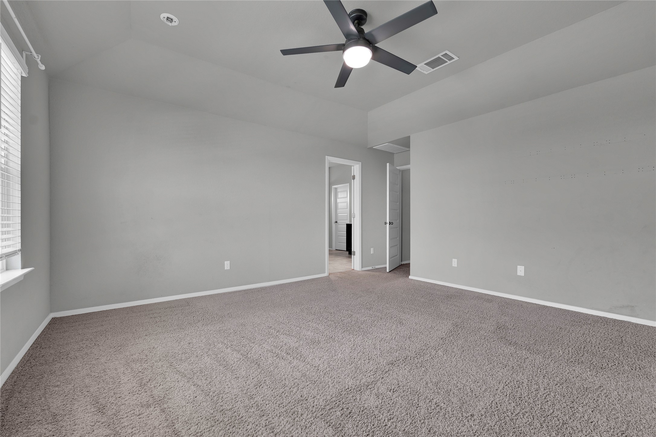 101 Crescent Street Georgetown, TX 78626 - Photo 16 of 39 Primary bedroom with recessed lighting and high ceilings.