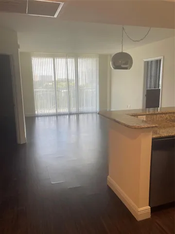 a view of a kitchen with a sink and dishwasher