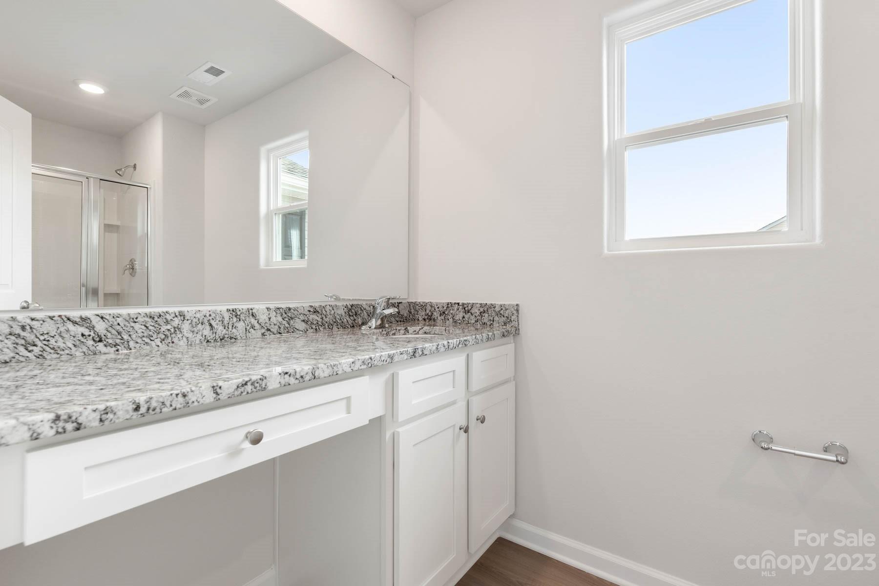 1518 Nia Road Charlotte, NC 28215 - Photo 12 of 14 a bathroom with a sink and a mirror