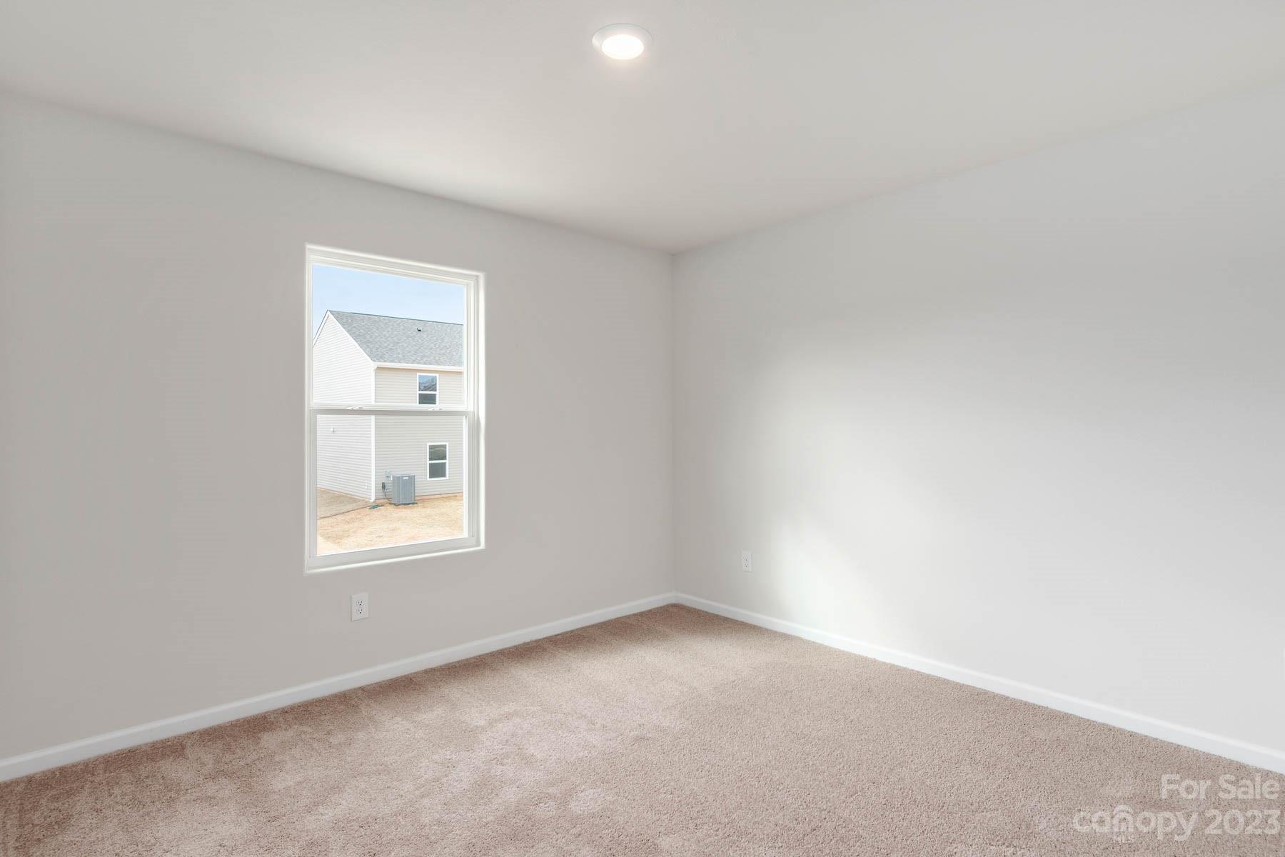 1518 Nia Road Charlotte, NC 28215 - Photo 13 of 14 an empty room with a window