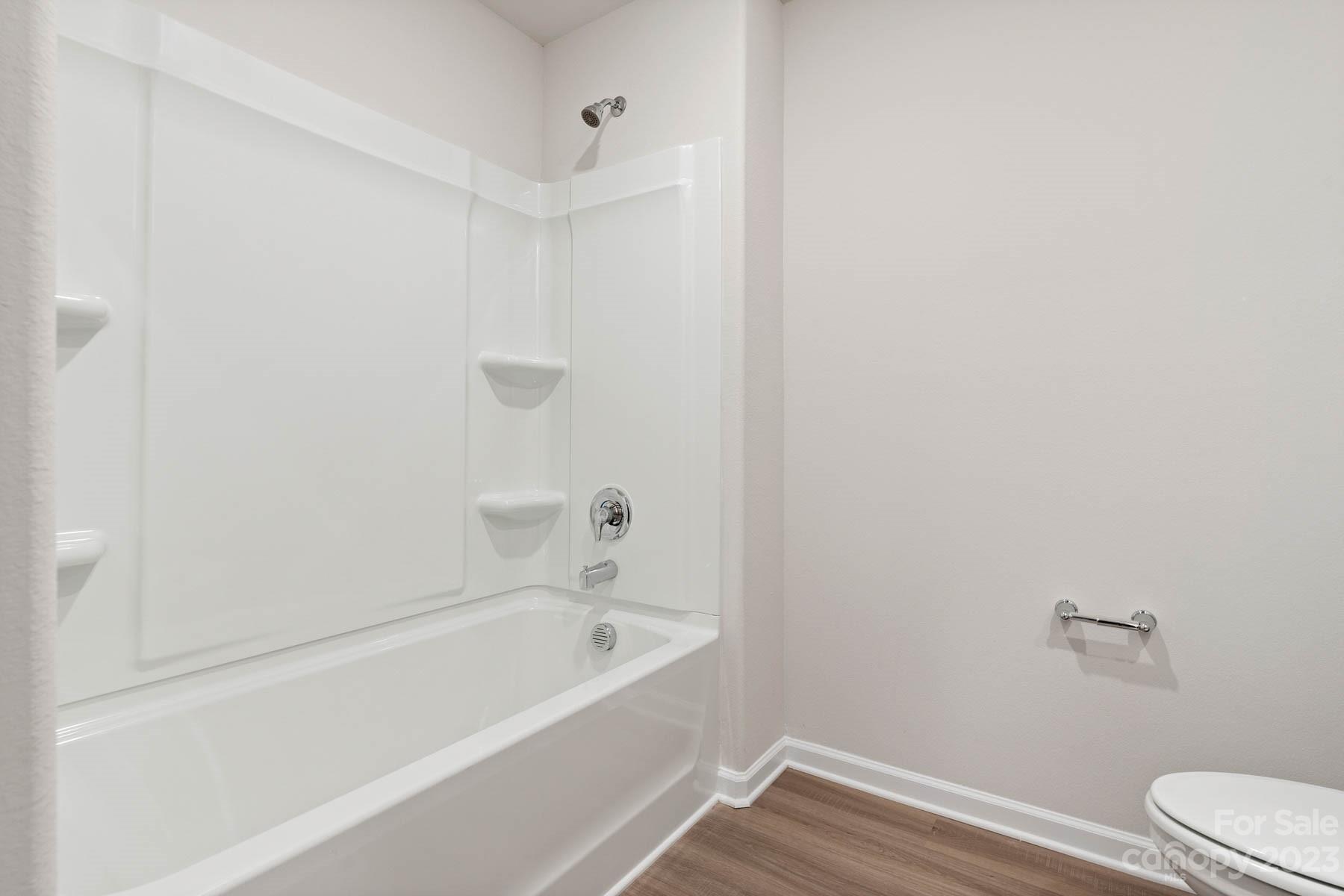 1518 Nia Road Charlotte, NC 28215 - Photo 14 of 14 a bathroom with a bathtub and toilet