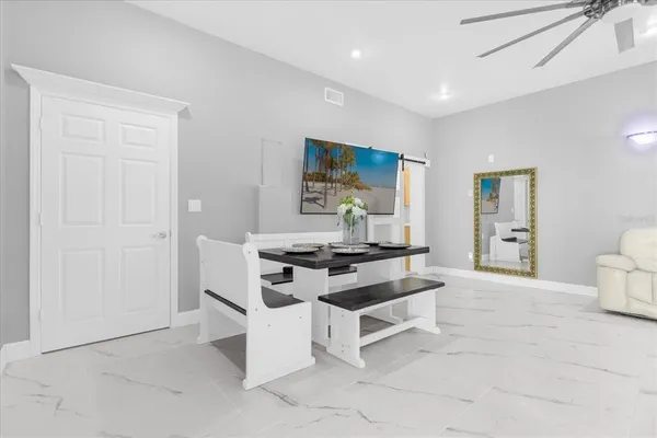 a kitchen with a white cabinets and appliances