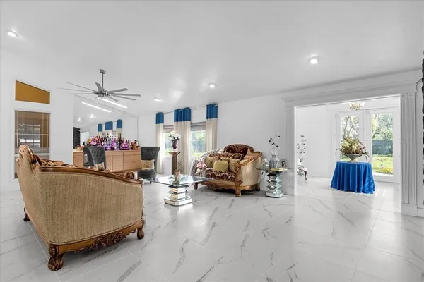 a kitchen with a stove a sink a refrigerator and cabinets