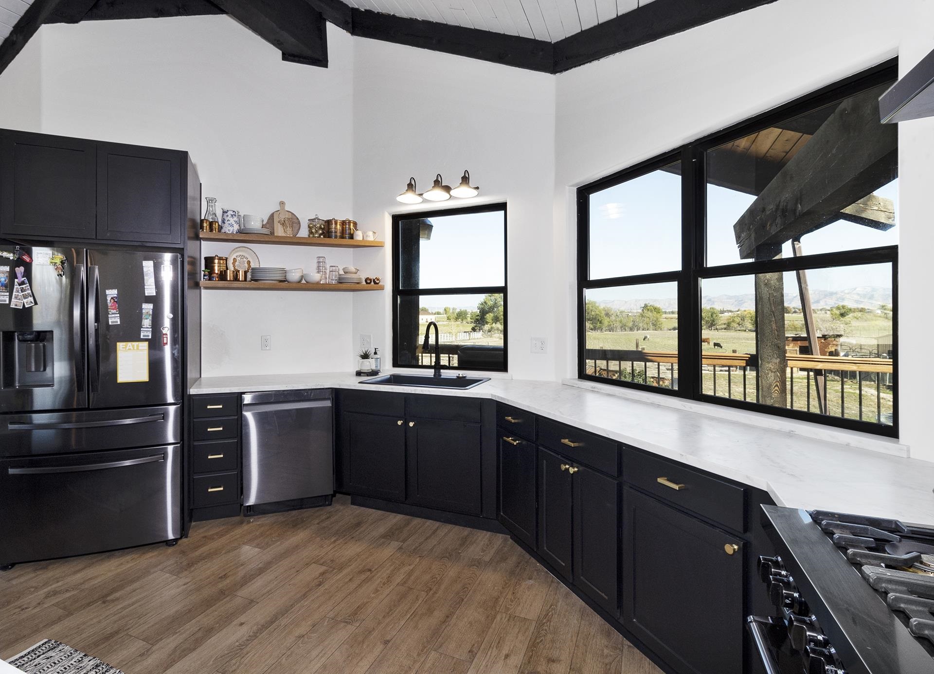 1874 L Road Fruita, CO 81521 - Photo 11 of 42 a kitchen with stainless steel appliances granite countertop a stove and a refrigerator