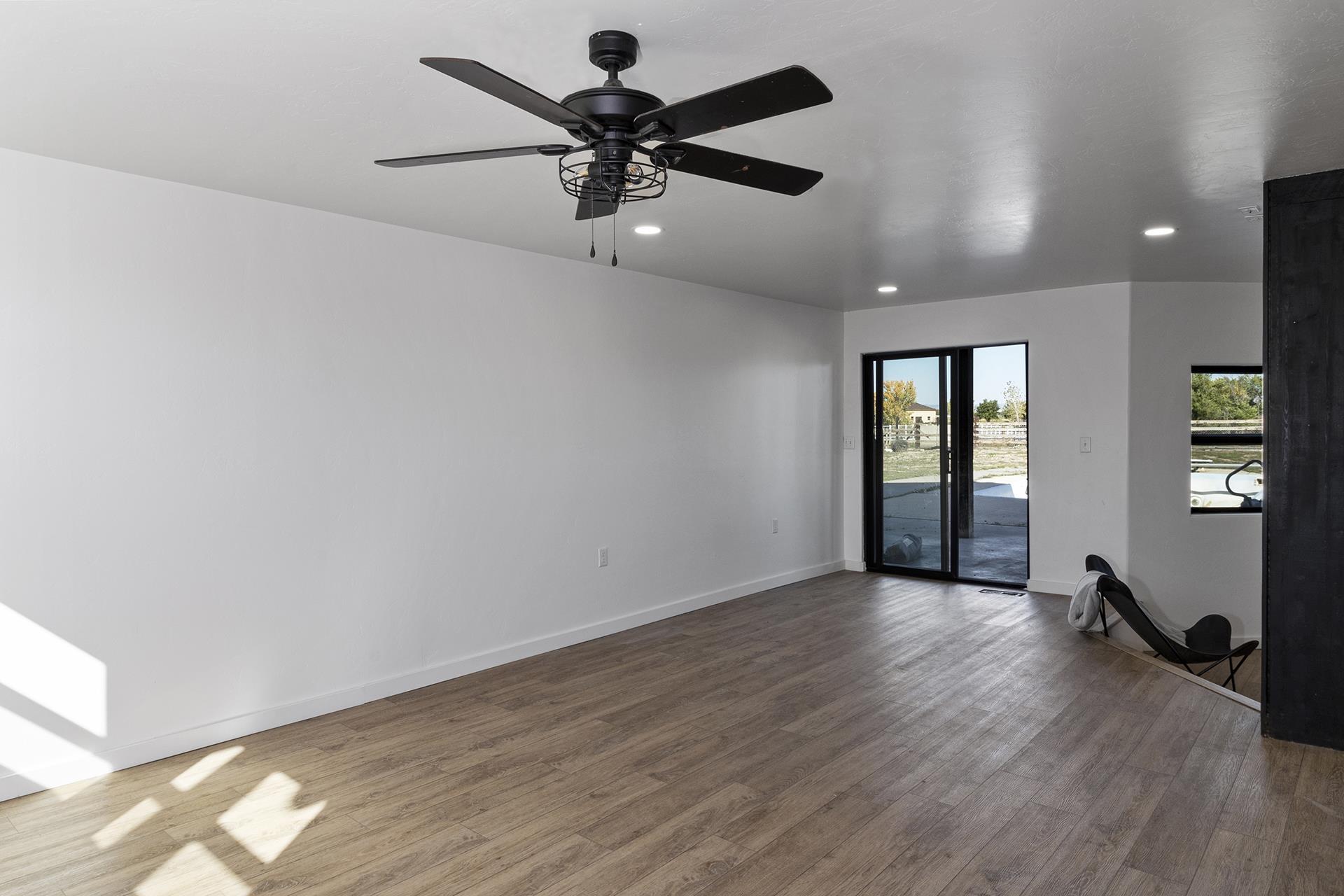 1874 L Road Fruita, CO 81521 - Photo 31 of 42 wooden floor in an empty room with a window