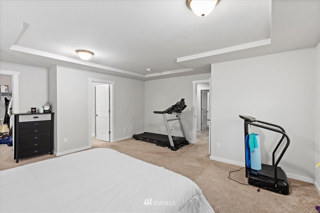 15817 Meridian Avenue South, Unit 38 Bothell, WA 98012 - Photo 15 of 35 a bedroom with a bed and a mirror
