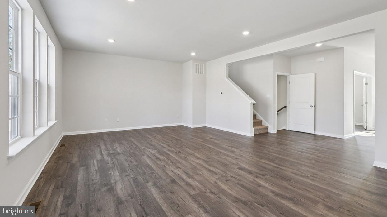 120 Winding Road Easton, PA 18040 - Photo 17 of 80 a view of empty room with wooden floor and fan