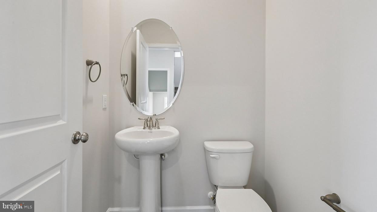 120 Winding Road Easton, PA 18040 - Photo 33 of 80 a bathroom with a toilet sink and mirror