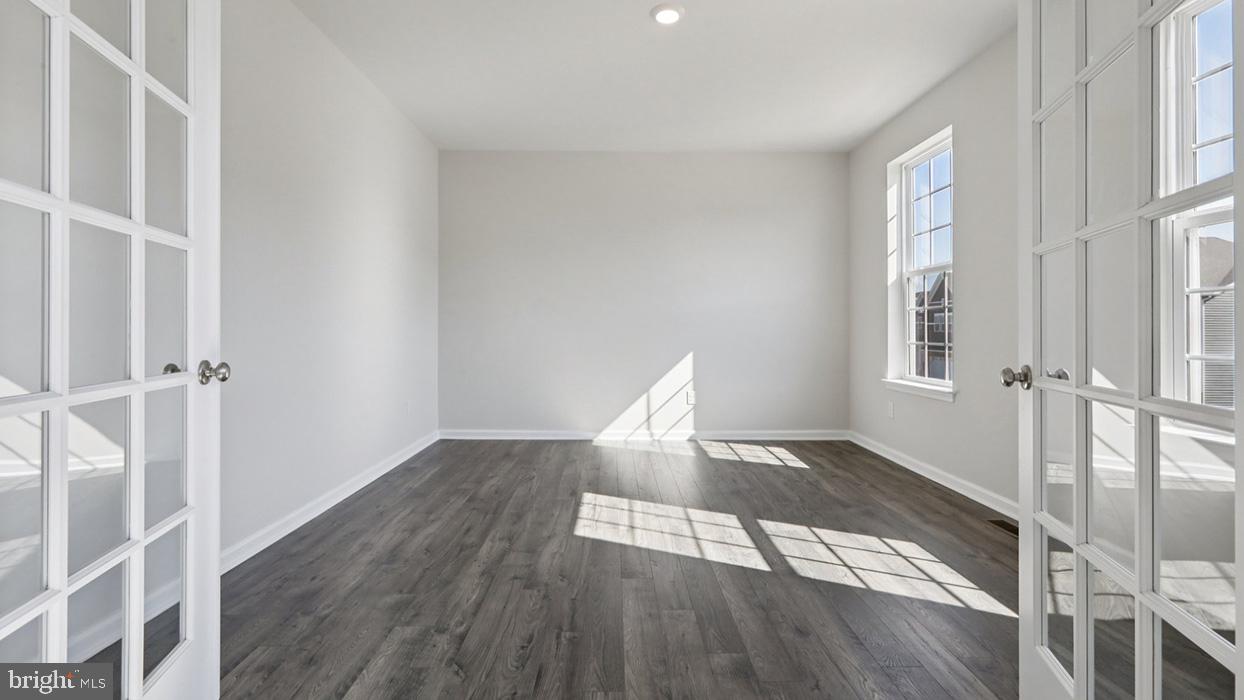 120 Winding Road Easton, PA 18040 - Photo 38 of 80 a view of an empty room with wooden floor and a window