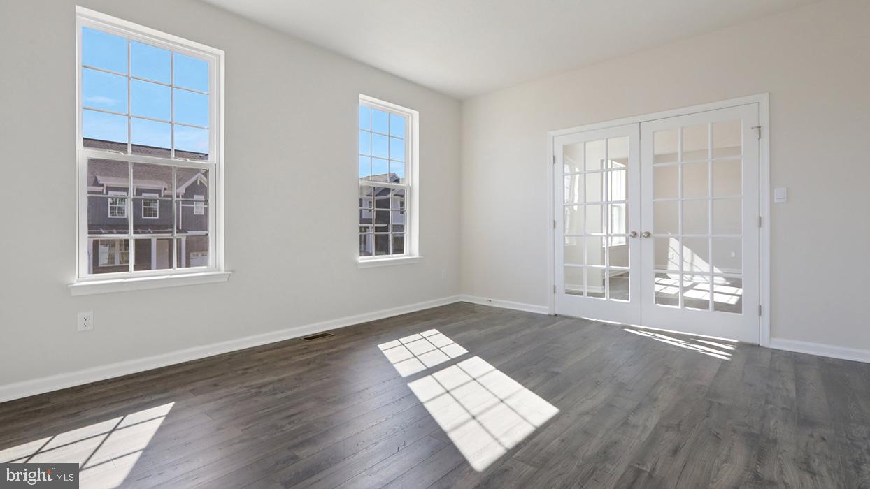 120 Winding Road Easton, PA 18040 - Photo 39 of 80 an empty room with wooden floor and windows