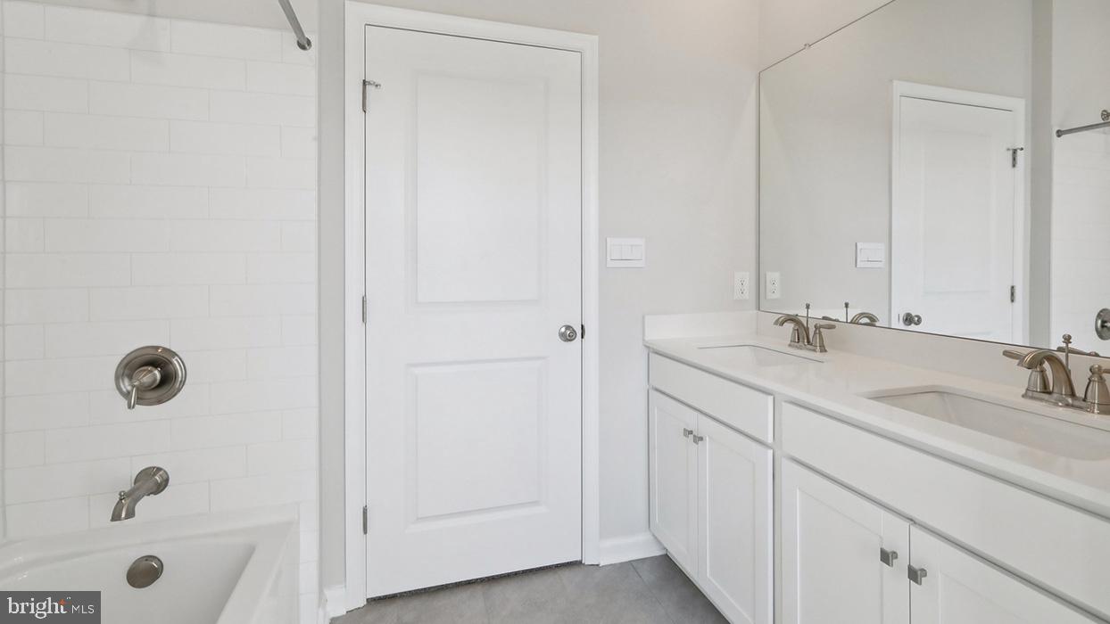 120 Winding Road Easton, PA 18040 - Photo 64 of 80 a bathroom with a tub a sink and mirror