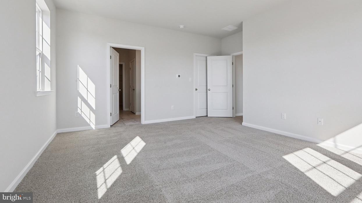 120 Winding Road Easton, PA 18040 - Photo 69 of 80 a view of an empty room with wooden floor and a window