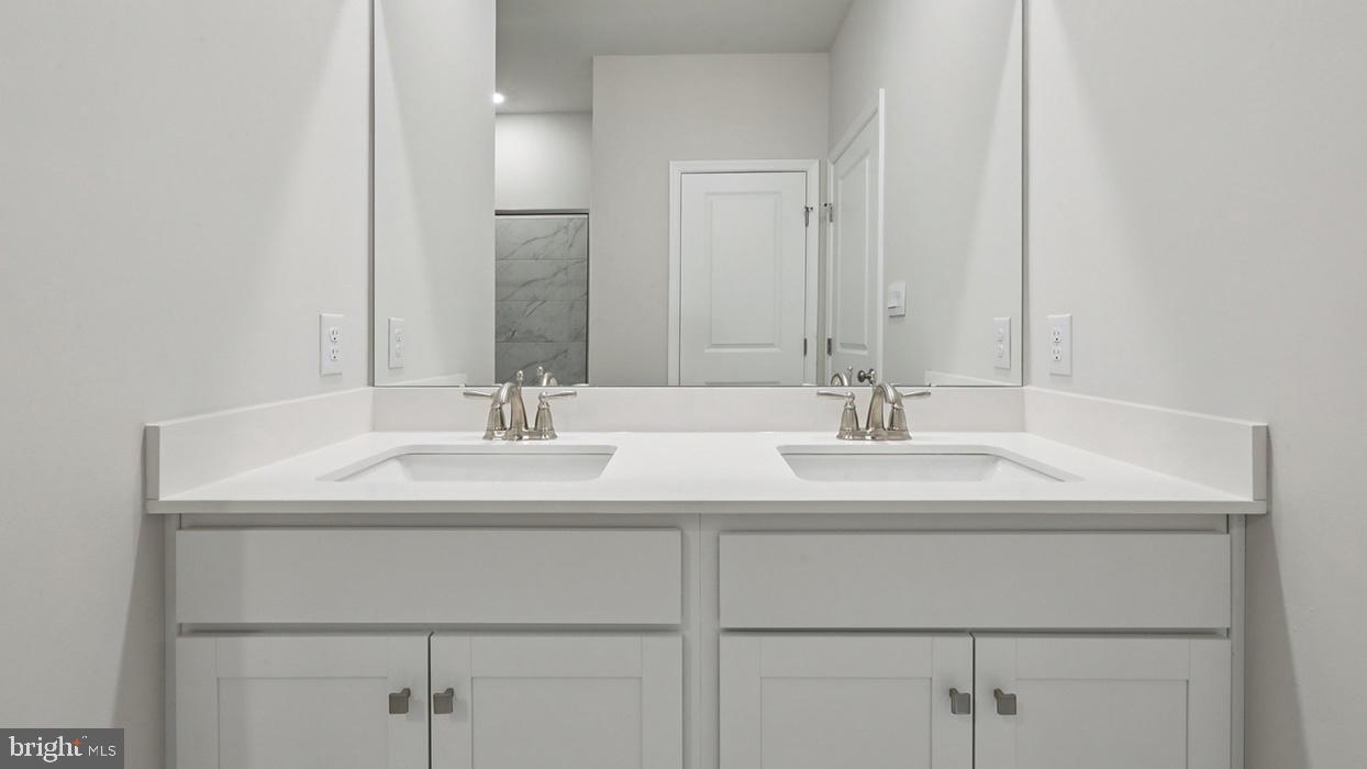 120 Winding Road Easton, PA 18040 - Photo 75 of 80 a bathroom with double sink and a mirror